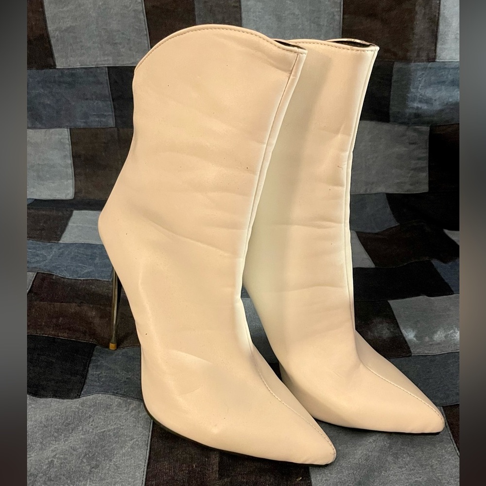 Matte white ankle boots.